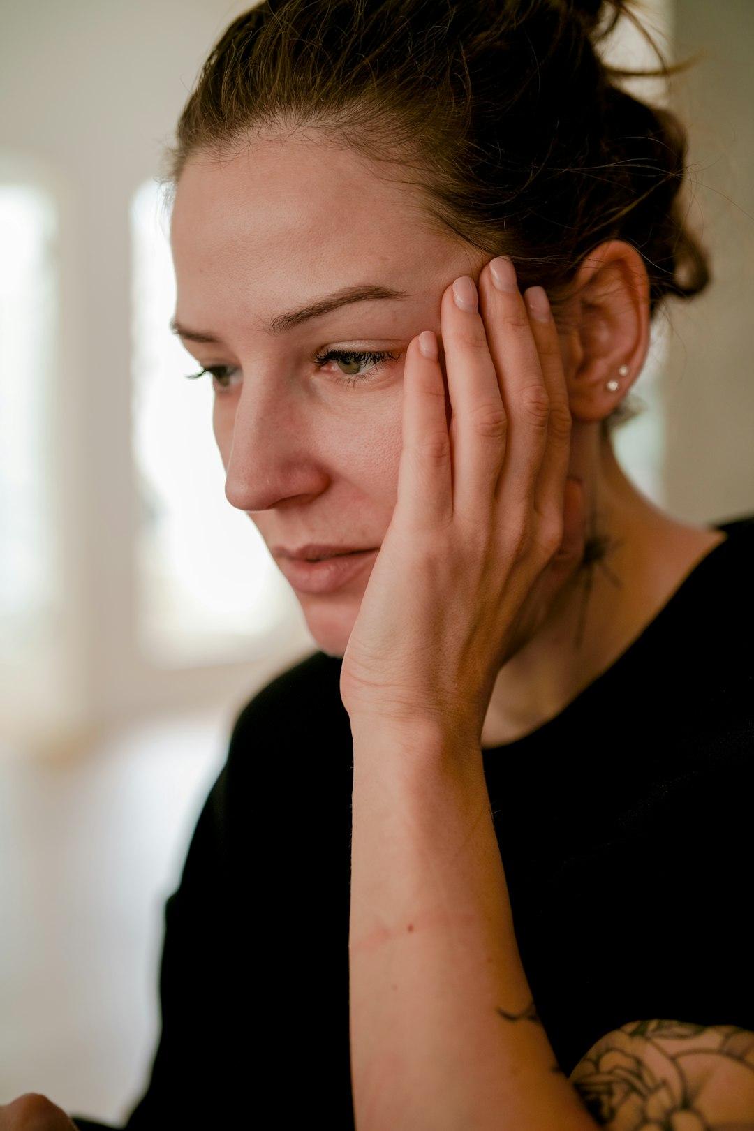 a person with the hand on the face- Sleep Deprivation