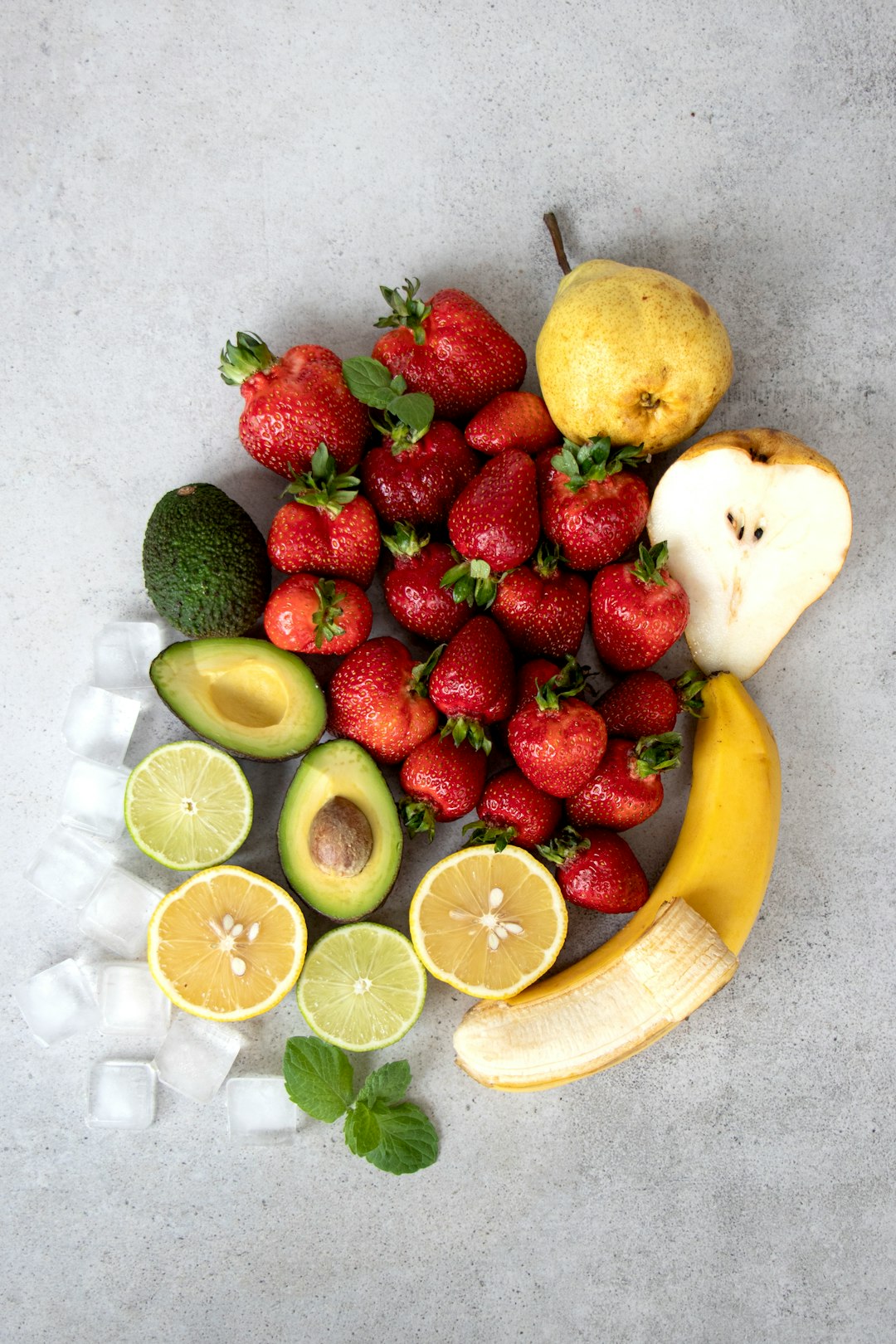 strawberries and bananas on white table - Anti-Inflammatory Foods