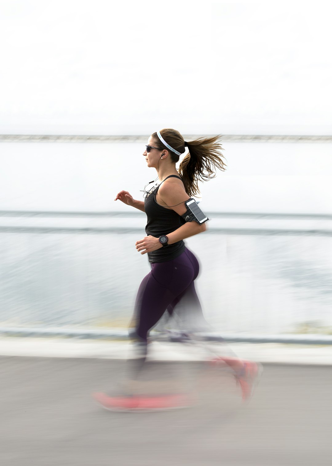 woman running wearing armband- Inflammation-Mental Health Connection