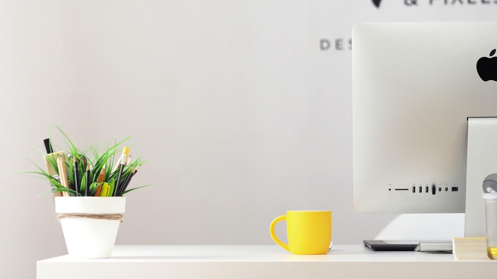 yellow ceramic mug beside gray aluminum iMac Detoxifying Your Home Office