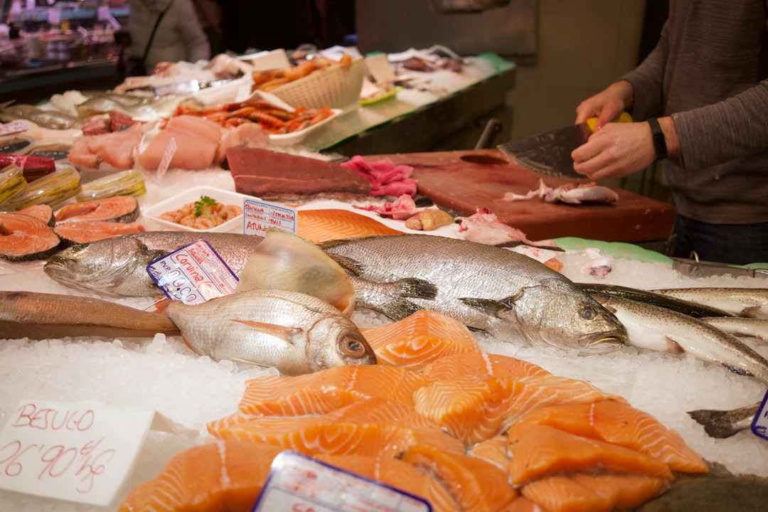 a person cutting fish- Fatty Acids