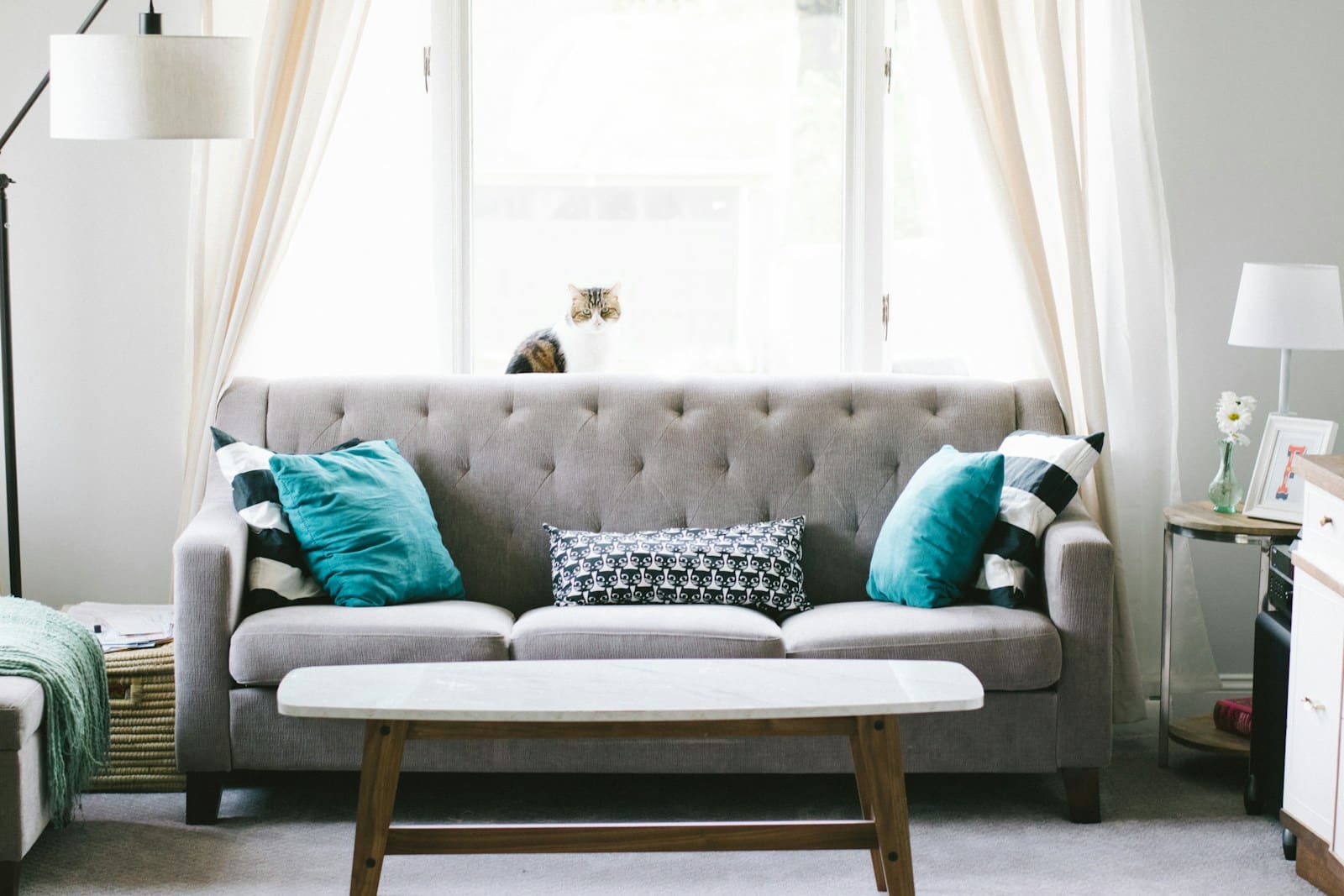 brown and white wooden table beside sofa chair Furniture and Fabrics