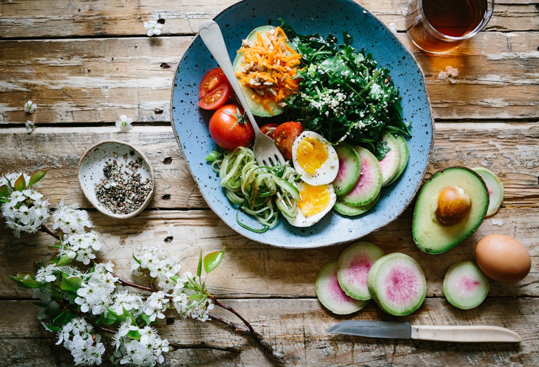 poached egg with vegetables and tomatoes on blue plate- Nutrition and Sleep