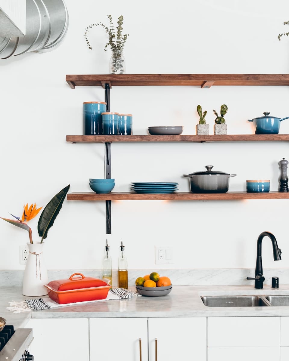 blue ceramic dinnerware on rack - Dangers in Your Kitchen