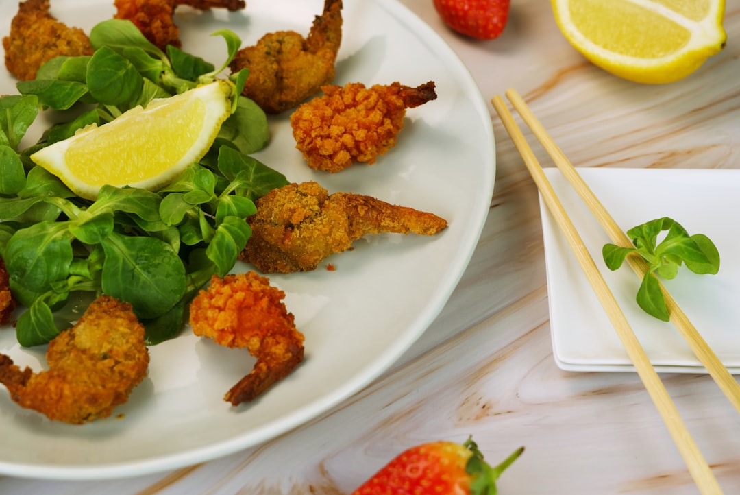 a white plate topped with shrimp and greens - Inflammation and Cognitive Decline