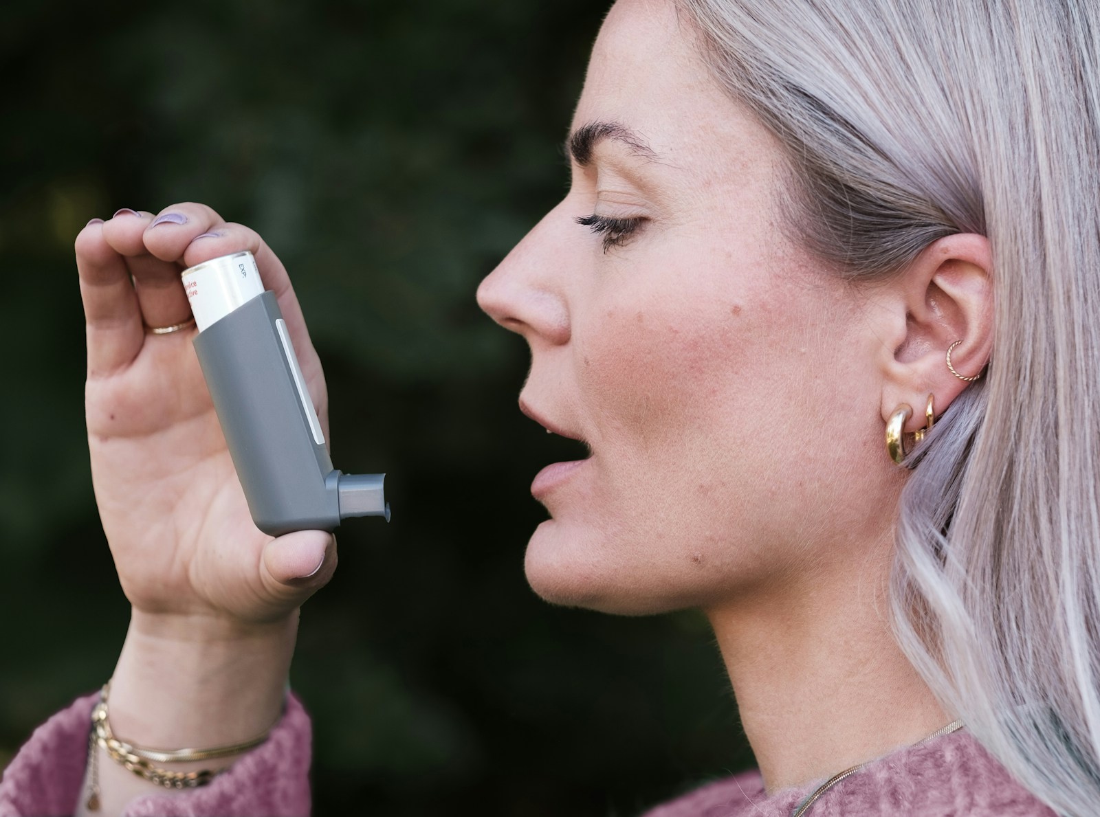 A woman holding a cell phone up to her face Chronic inflammation